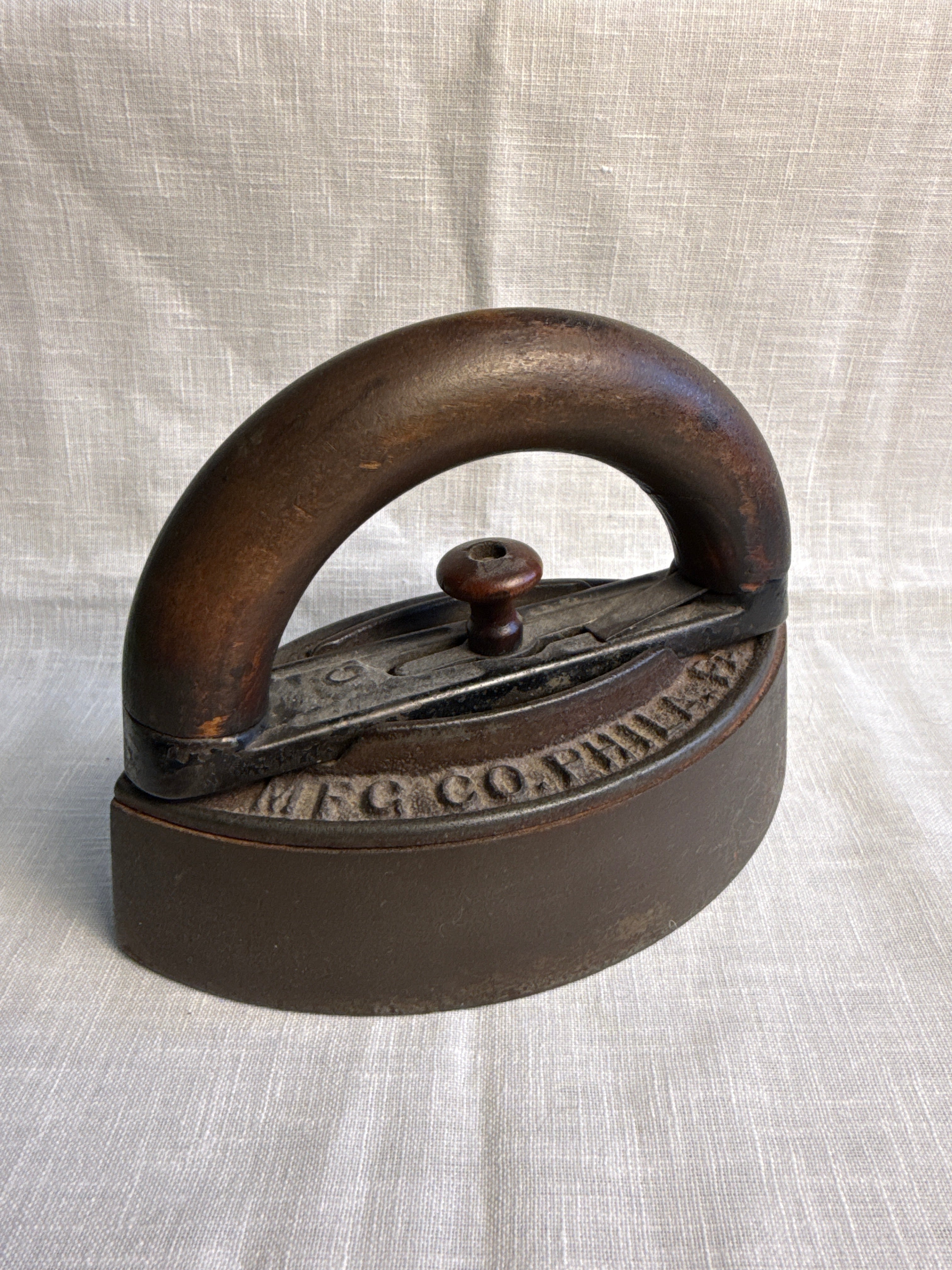 Two piece wooden Handle Sad Iron 7”
